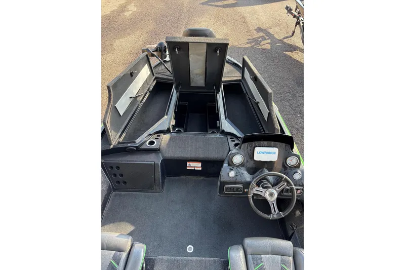 Slide: The Image of 2019 Nitro Z18 boat interior with open storage compartments and steering console. - 4