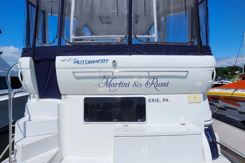 Slide: The Image of 2008 CRUISERS INC 415 Express Motoryacht docked, featuring "Martini & Russi" name, Erie, PA. - 1
