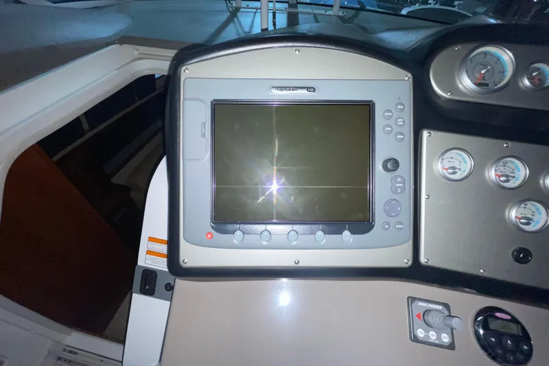 Slide: The Image of Control panel of 2008 CRUISERS INC 415 Express Motoryacht with navigation display and gauges. - 10