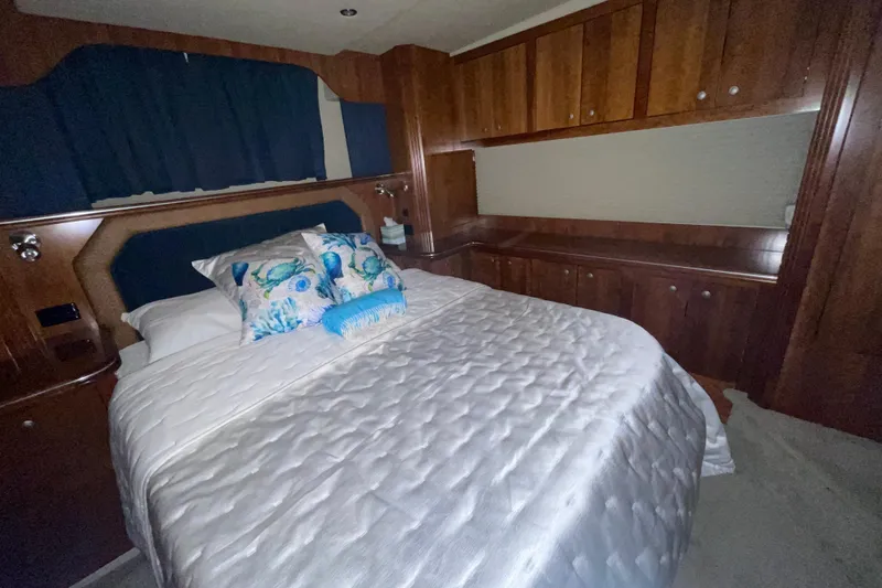 Slide: The Image of Luxurious bedroom in 2008 CRUISERS INC 415 Express Motoryacht with elegant wood cabinetry. - 16