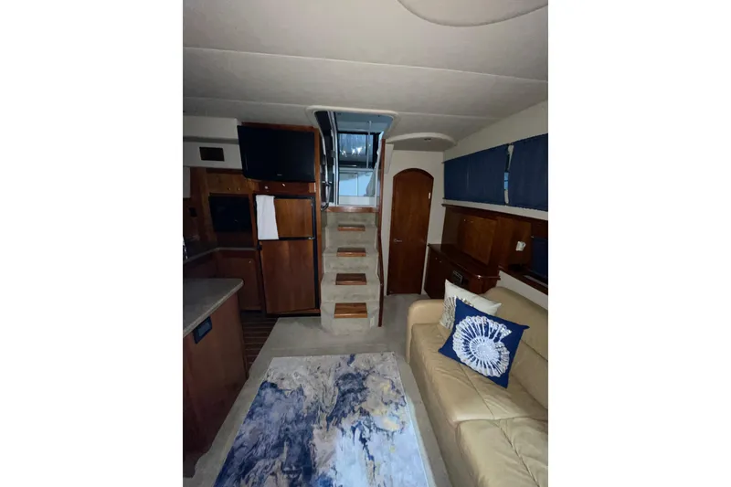 Slide: The Image of Interior of 2008 CRUISERS INC 415 Express Motoryacht with cozy seating and modern amenities. - 19
