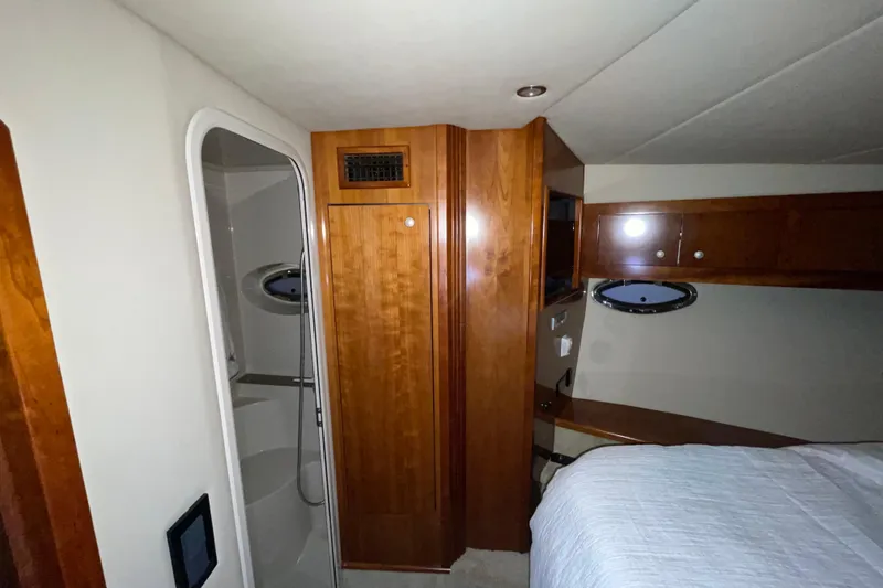 Slide: The Image of Interior of 2008 CRUISERS INC 415 Express Motoryacht with wood cabinetry and porthole window. - 23