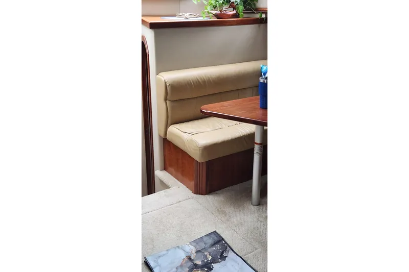 Slide: The Image of Interior of 2008 CRUISERS INC 415 Express Motoryacht with beige seating and wooden table. - 34
