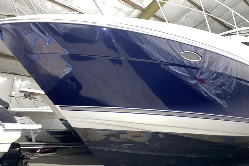Slide: The Image of 2008 CRUISERS INC 415 Express Motoryacht in storage, showcasing sleek blue hull design. - 5