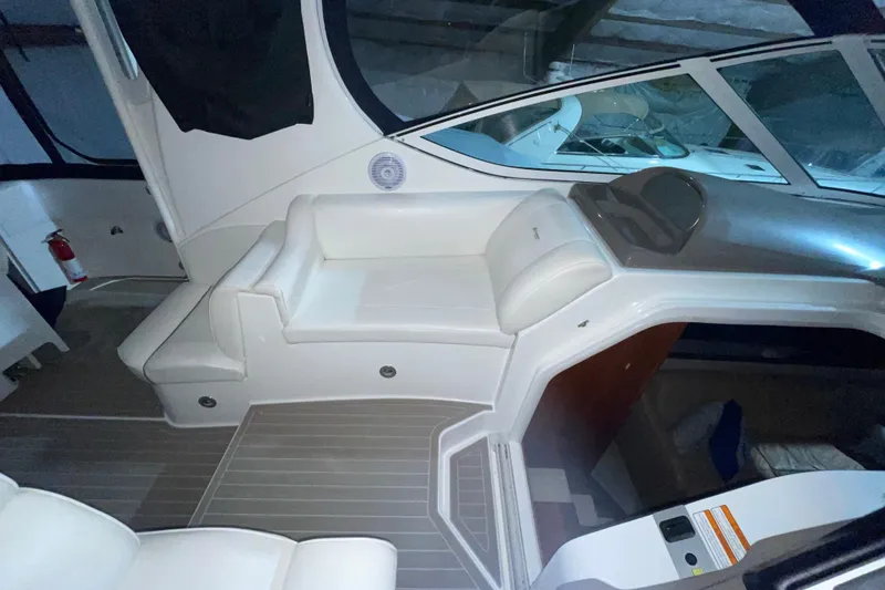 Slide: The Image of 2008 CRUISERS INC 415 Express Motoryacht interior with white seating and modern design. - 9