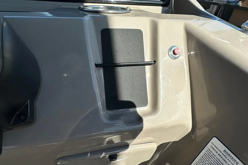 Slide: The Image of 2024 Ranger Reata 200C dashboard detail with control panel and button. - 14