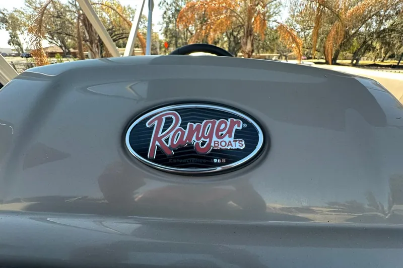 Slide: The Image of 2024 Ranger Reata 200C boat logo with trees in the background. - 20