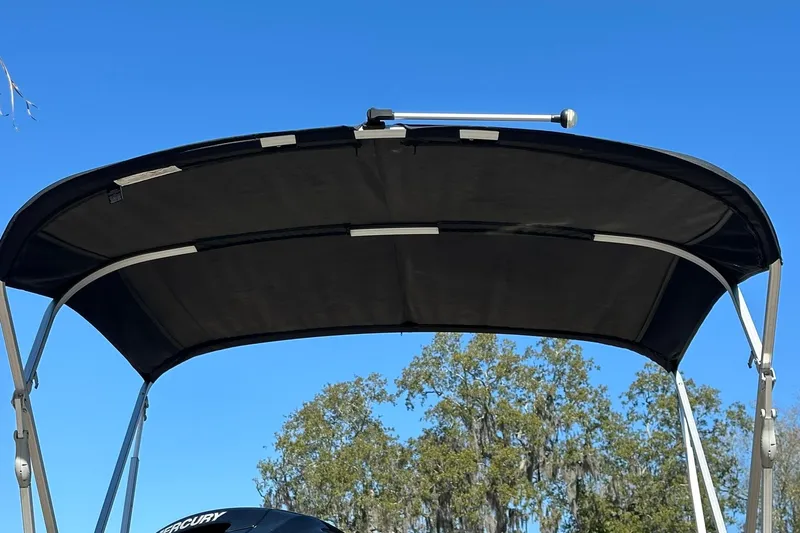 Slide: The Image of 2024 Ranger Reata 200C boat canopy against clear blue sky. - 28