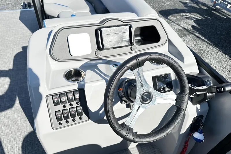 Slide: The Image of 2025 Bentley 223 Bolt Tri Toon steering console with modern controls and sleek design. - 11