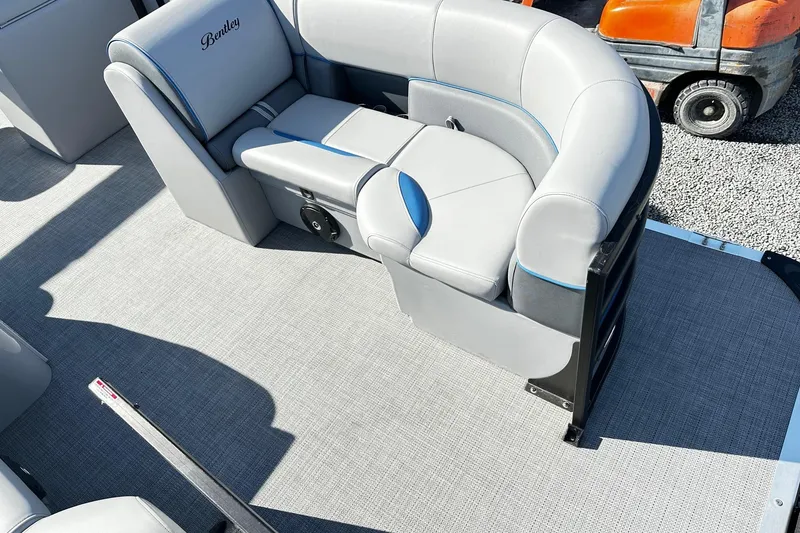 Slide: The Image of 2025 Bentley 223 Bolt Tri Toon boat with luxurious gray seating and modern design. - 14