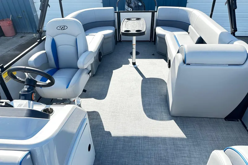 Slide: The Image of 2025 Bentley 223 Bolt Tri Toon interior with plush seating and modern helm. - 3
