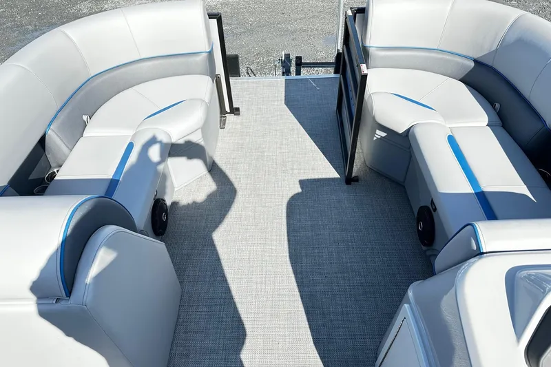 Slide: The Image of Interior of 2025 Bentley 223 Bolt Tri Toon with plush seating and modern design. - 7
