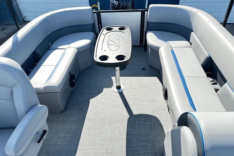 Slide: The Image of 2025 Bentley 223 Bolt Tri Toon interior with gray seating and central table. - 8