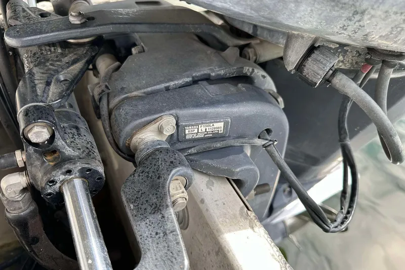 Slide: The Image of Close-up of a Yamaha motor component on a 2013 SunCatcher V322 RC boat. - 17