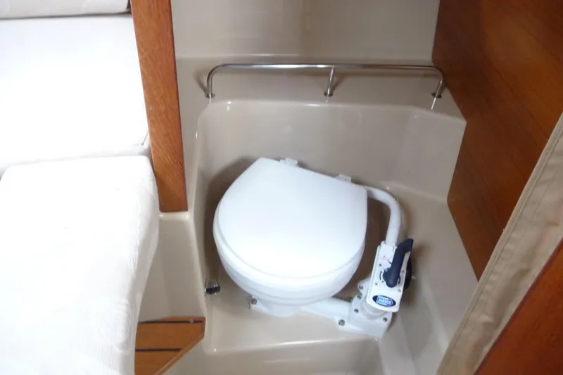 Slide: The Image of 2017 Ranger Tugs R-23 boat interior with compact marine toilet. - 23