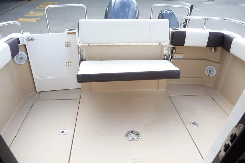 Slide: The Image of 2017 Ranger Tugs R-23 boat interior with seating and storage compartments. - 27