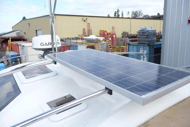Slide: The Image of 2017 Ranger Tugs R-23 boat with solar panel and Garmin radar in a storage yard. - 29