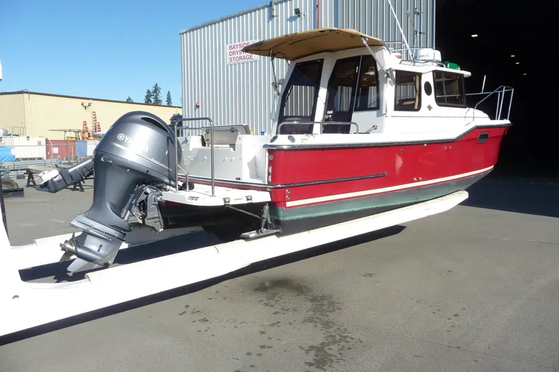 Slide: The Image of 2017 Ranger Tugs R-23 boat with Yamaha outboard motor at storage facility. - 8