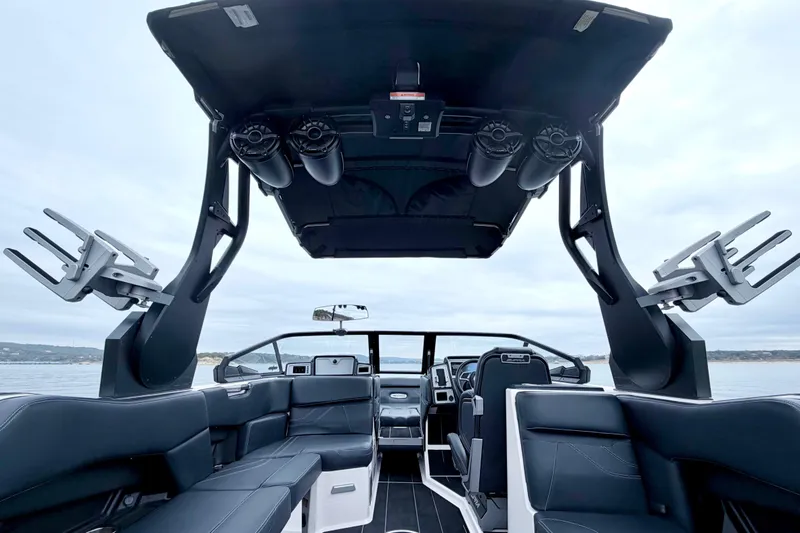 Slide: The Image of 2023 Supra SE 550 boat interior with sleek seating and advanced audio system. - 30