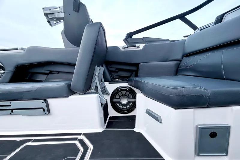 Slide: The Image of 2023 Supra SE 550 boat interior with sleek seating and integrated speaker system. - 35