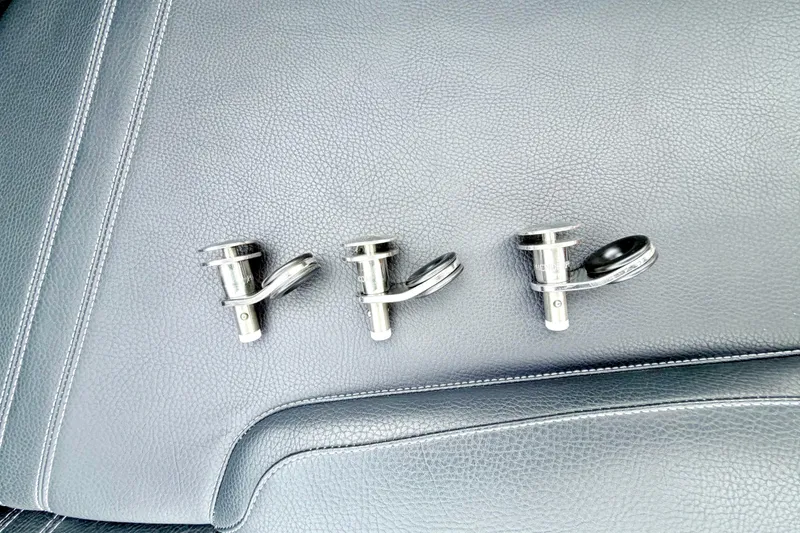 Slide: The Image of Three metal boat cleats on black leather seat, 2023 Supra SE 550. - 37