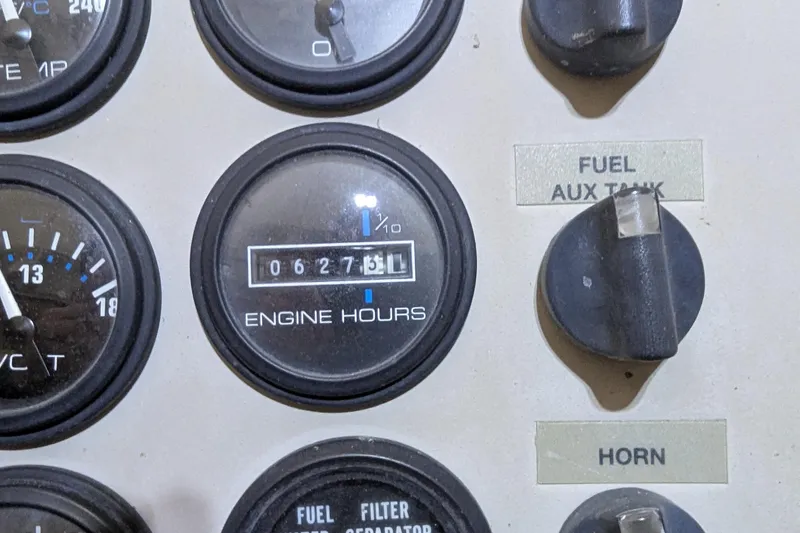 Slide: The Image of Close-up of Carver 404 Cockpit Motor Yacht 2000 engine hours gauge, showing 627.5 hours. - 11