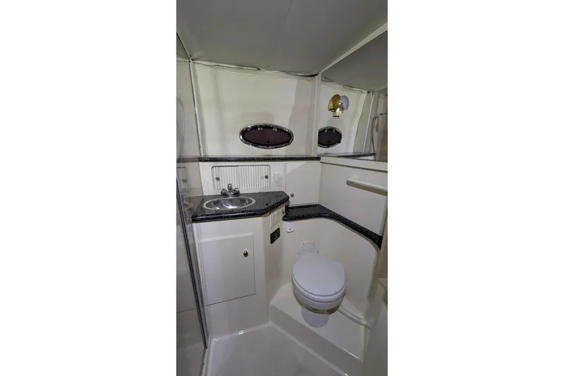 Slide: The Image of Bathroom interior of 2000 Carver 404 Cockpit Motor Yacht with sink and toilet. - 24