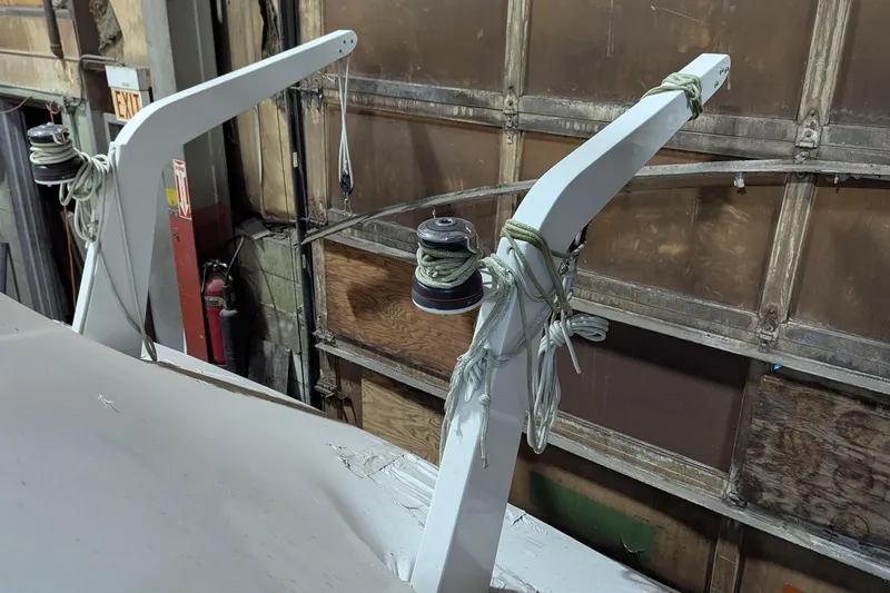 Slide: The Image of 2000 Carver 404 Cockpit Motor Yacht in a workshop, showing rigging and equipment. - 14