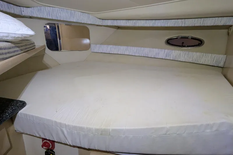 Slide: The Image of Interior cabin of 2000 Carver 404 Cockpit Motor Yacht with bed and porthole. - 7