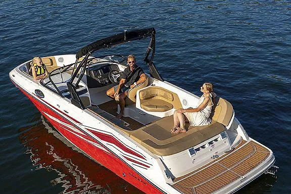 The Image of 2024 Bayliner VR6 Bowrider I/O boat on trailer, blue and white exterior. - 1