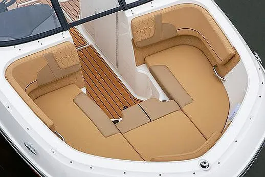 Slide: The Image of 2024 Bayliner VR6 Bowrider I/O with spacious tan seating and canopy. - 5