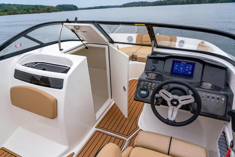 Slide: The Image of 2024 Bayliner VR6 Bowrider I/O boat interior with steering console and seating. - 9