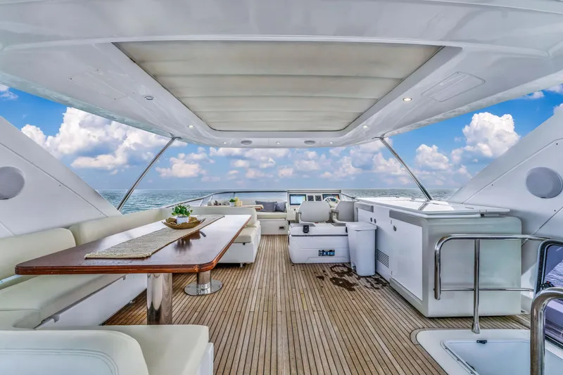 Slide: The Image of Luxurious 2016 Azimut Fly 72 yacht interior with elegant seating and ocean view. - 14