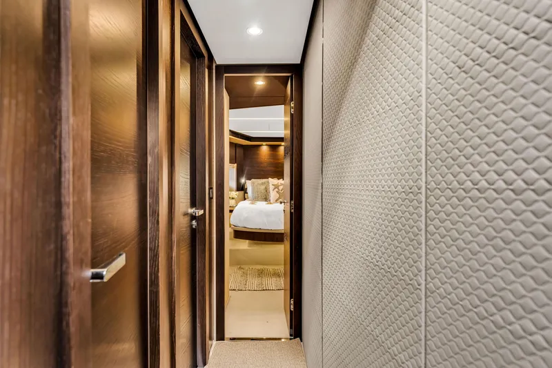 Slide: The Image of Luxurious interior hallway of 2016 Azimut Fly 72 yacht, leading to a cozy bedroom. - 26