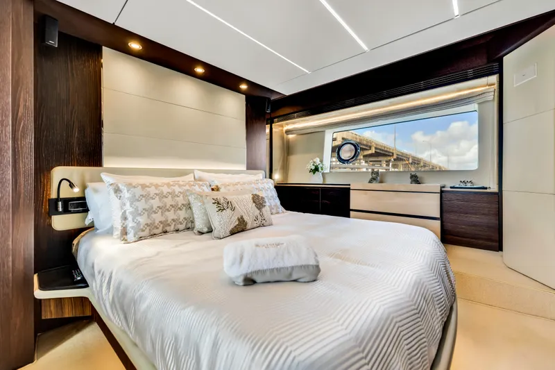 Slide: The Image of Luxurious bedroom interior of 2016 Azimut Fly 72 yacht with elegant decor and large window view. - 30
