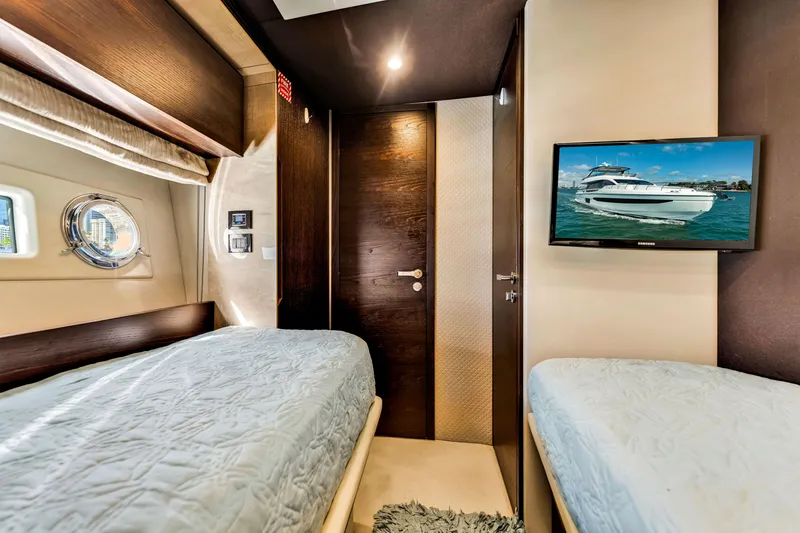 Slide: The Image of Interior of 2016 Azimut Fly 72 yacht cabin with twin beds and wall-mounted TV. - 47