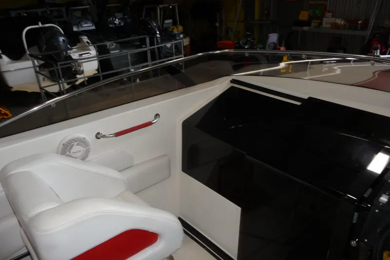Slide: The Image of 1989 Baja 280 Sportfish boat interior with white seating and red accents. - 16