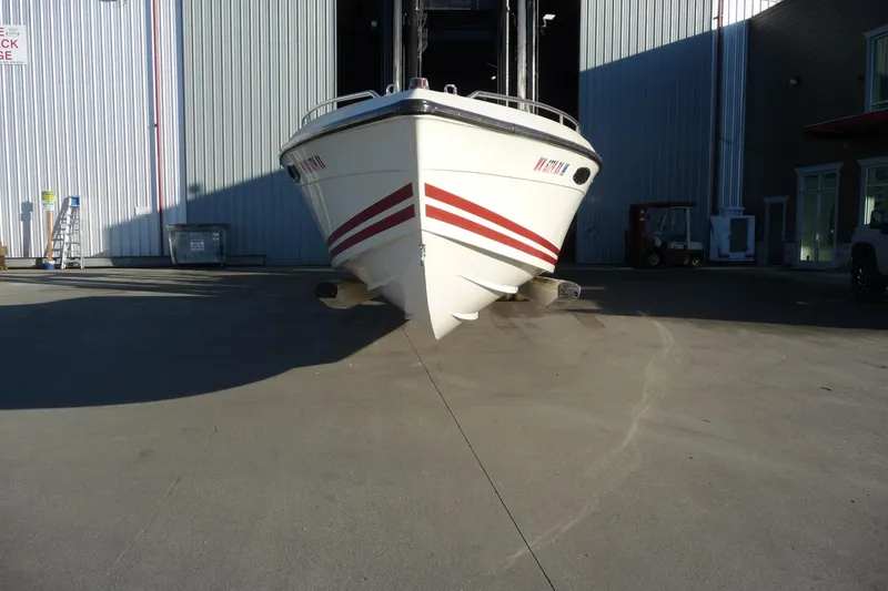 Slide: The Image of 1989 Baja 280 Sportfish boat in a storage facility, front view. - 2