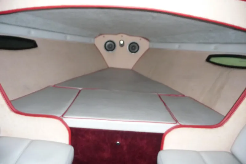 Slide: The Image of 1989 Baja 280 Sportfish cabin interior with cushioned seating and speakers. - 22