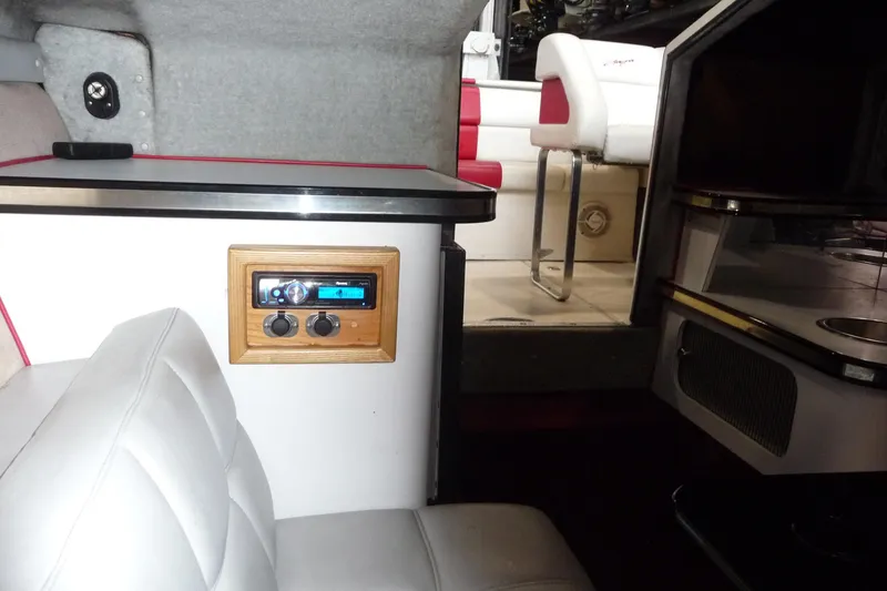 Slide: The Image of Interior of 1989 Baja 280 Sportfish boat with seating and audio system. - 23