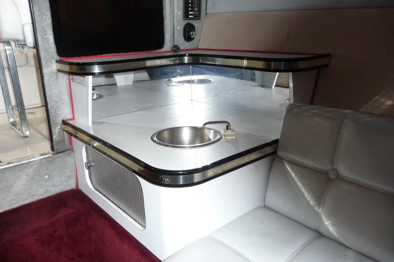 Slide: The Image of 1989 Baja 280 Sportfish interior with seating and compact sink area. - 24