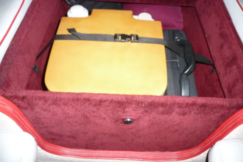 Slide: The Image of Storage compartment in a 1989 Baja 280 Sportfish boat with secured equipment. - 28