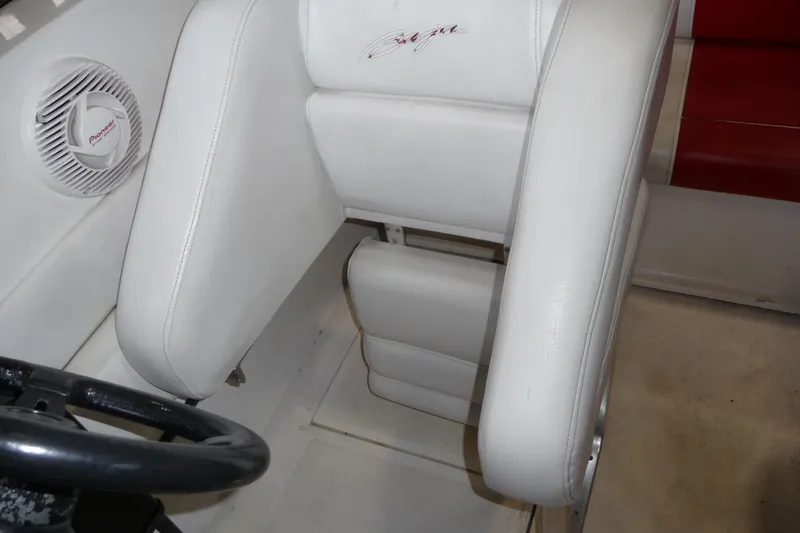Slide: The Image of 1989 Baja 280 Sportfish boat interior with white seating and Pioneer speaker. - 29