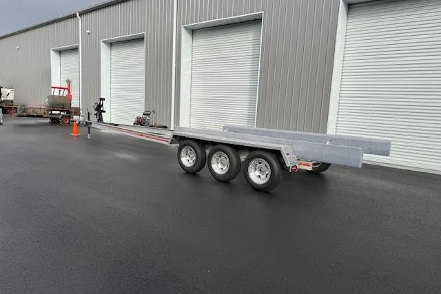 Slide: The Image of 1989 Baja 280 Sportfish trailer parked outside industrial building with closed garage doors. - 32