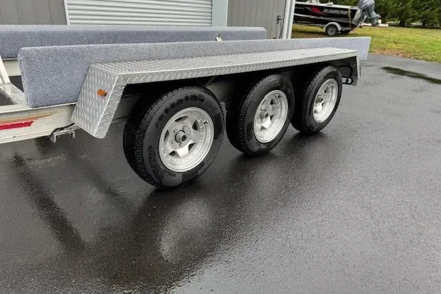 Slide: The Image of Triple-axle boat trailer for 1989 Baja 280 Sportfish on wet pavement. - 33