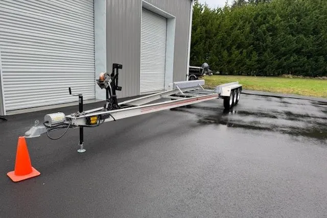 Slide: The Image of Boat trailer parked outside a garage, designed for 1989 Baja 280 Sportfish. - 36