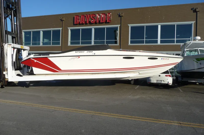 Slide: The Image of 1989 Baja 280 Sportfish boat with red accents at Bayside marina. - 4