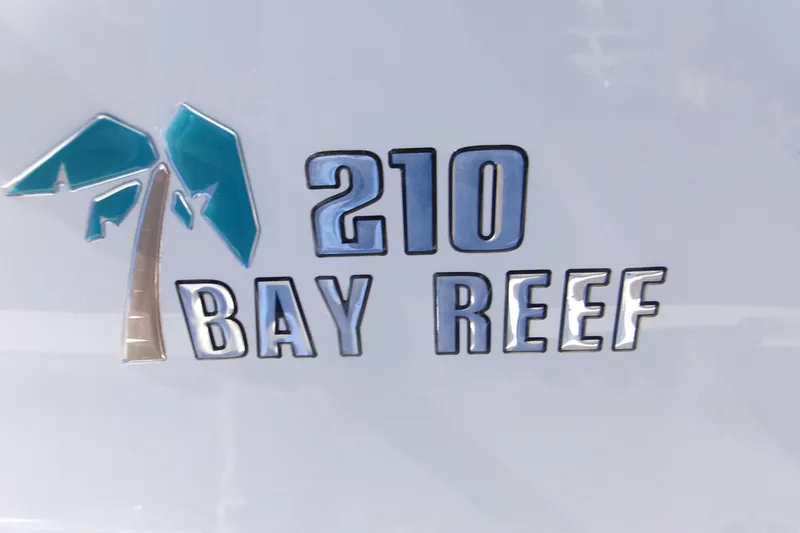 Slide: The Image of 2026 Key West 210 Bay Reef logo with palm tree design. - 20