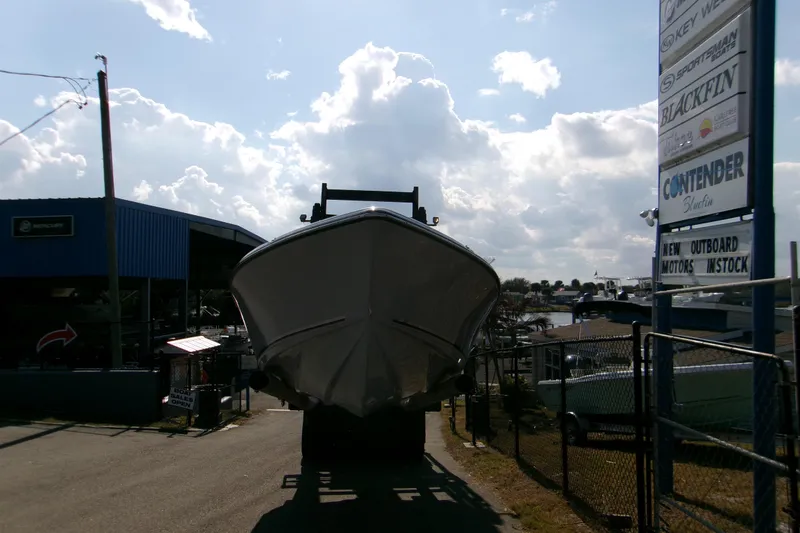 Slide: The Image of 2026 Key West 210 Bay Reef boat on trailer at dealership under cloudy sky. - 3