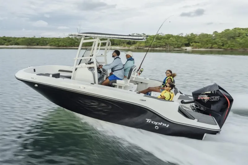 Slide: The Image of Manufacturer Provided Image: 2025 Bayliner Trophy T20CC boat cruising on a lake with passengers enjoying the ride. - 0